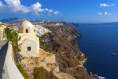 Panoramic view of sea and buildings against sky