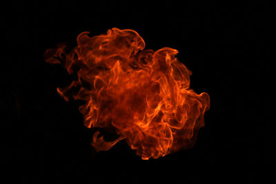 Close-up of bonfire against black background