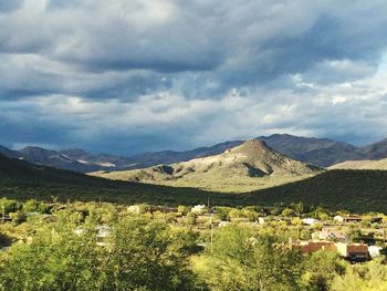 Scenic view of mountains against cloudy sky