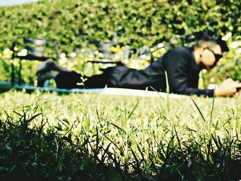 Woman with cat on grass