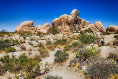 Rock formations in desert against sky