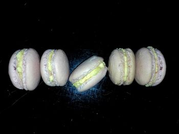 High angle view of candies against black background