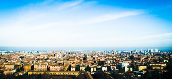 Cityscape against cloudy sky