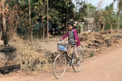 Portrait of woman with bicycle