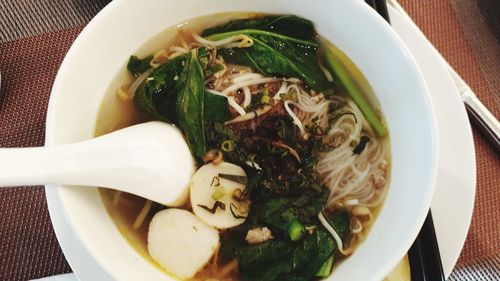 Directly above shot of noodle soup in bowl on table