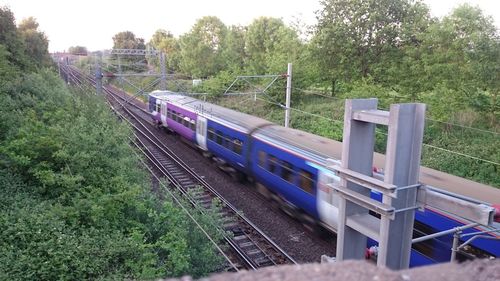 Train on railroad track against sky