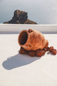 High angle view of urn on building terrace by sea