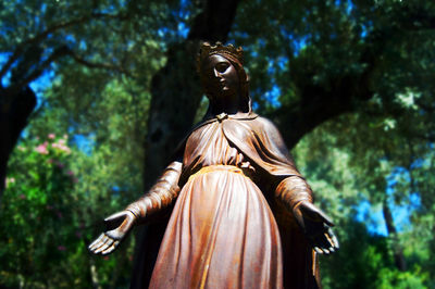 Low angle view of statue against sky