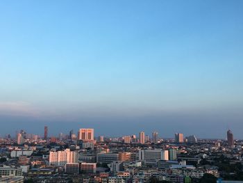 High angle view of buildings in city against sky