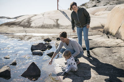 Mothers with daughter at sea