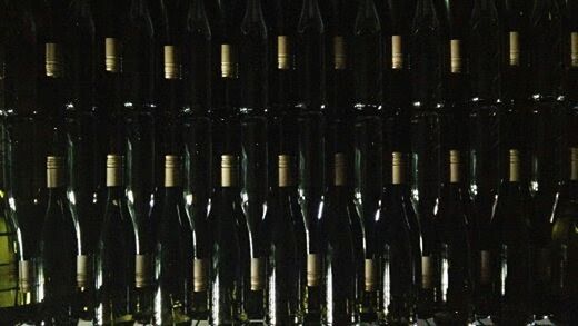 alcohol, bottle, refreshment, drink, wine bottle, wine, food and drink, in a row, large group of objects, wine cellar, container, cellar, abundance, winemaking, rack, no people, winery, dark, glass, indoors, red wine, nightlife