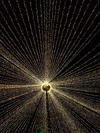 Illuminated tunnel at night