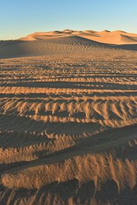 Scenic view of desert against clear sky