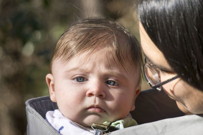 Close-up of baby boy with mother