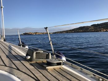 Sailboat on sea against clear sky