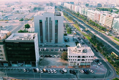High angle view of traffic on road by buildings