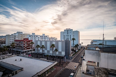 High angle view of buildings against sky during sunset