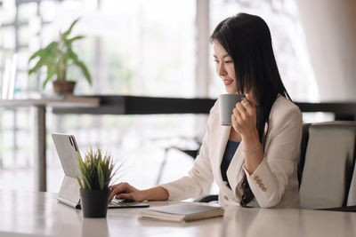 Woman working on table