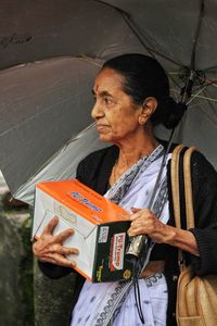 Mid adult woman looking away