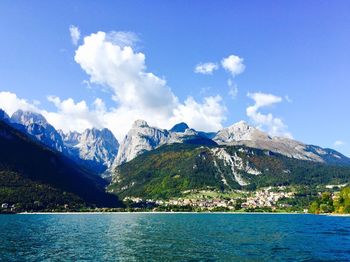 Scenic view of lake and mountains against sky