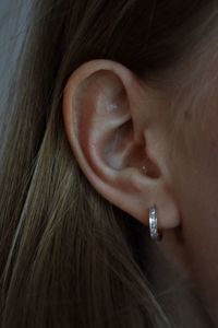 Close-up portrait of woman ear