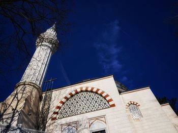 Low angle view of traditional building against blue sky