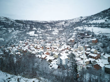 A beautiful mountain village with a bird perspective during the winter cover