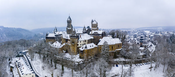 Panoramic view of traditional building against sky during winter