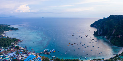 Passenger parking shipping in high season on phi phi island kra bi thailand aerial top view 