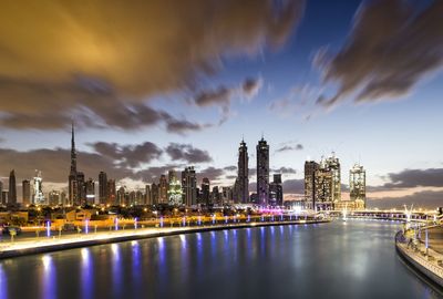 Illuminated city at waterfront