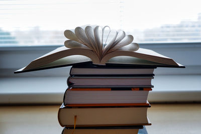 Close-up of stack of books on table