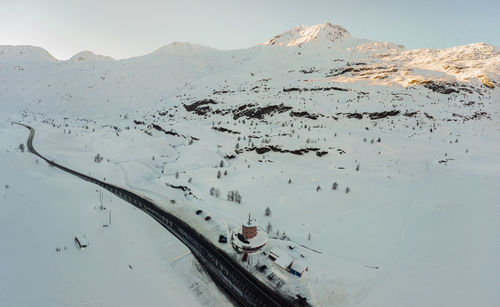 High angle view of snowcapped mountain against sky