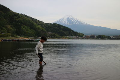 Boy standing in lake