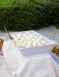 Dish of mozzarella on table in a garden party