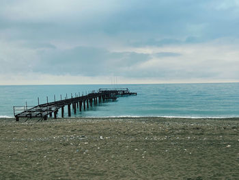 Pier on sea against sky