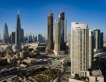 Modern buildings in city against sky