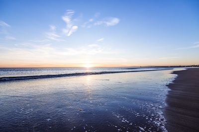 Scenic view of sea against sky at sunset