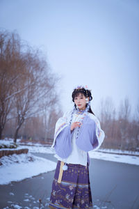 A girl in hanfu in the snow