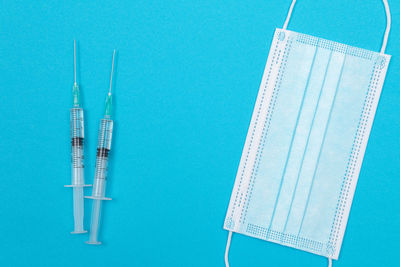 Directly above shot of blue container over white background