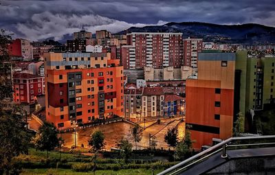 High angle view of buildings in city against sky