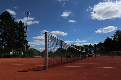 Scenic view of tennisfield against sky