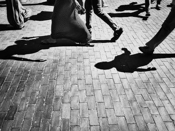 Shadow of people on road