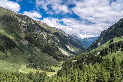 Scenic view of landscape and mountains against sky