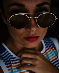 Close-up portrait of man wearing sunglasses