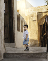 Portrait of boy standing outdoors