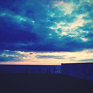 Scenic view of sea against cloudy sky