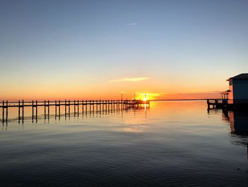 Scenic view of sea against clear sky during sunset