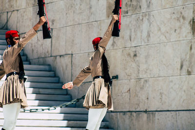 People hanging on wall