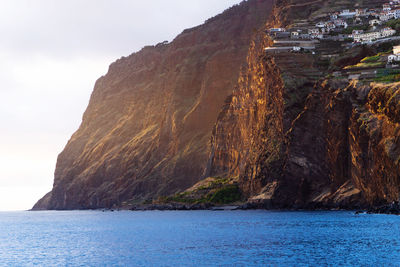 Scenic view of bay against sky