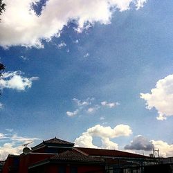 High section of building against cloudy sky